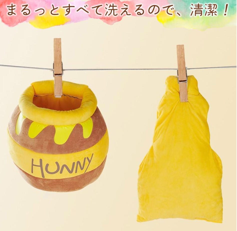はちみつポット型の猫用ベッド（洗える）、PetoPop製、ハチミツが垂れる模様入り、洗濯バサミで吊るされている